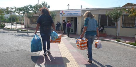Volunteers bringing medicines to the clinic. Photo from the BBC. 